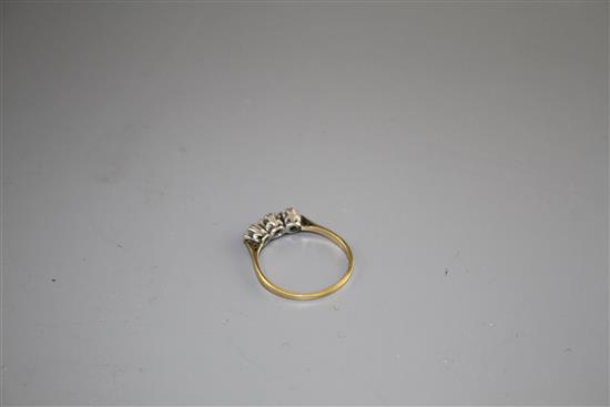 An 18ct and Plat, three stone diamond ring, size P, gross weight 1.8 grams,